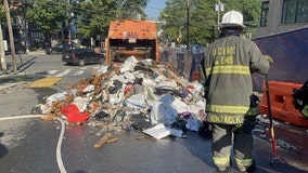 Garbage truck catches fire in DC, trash dumped onto street