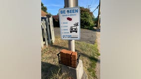 Arlington resident uses fake bricks to call for safer crosswalks