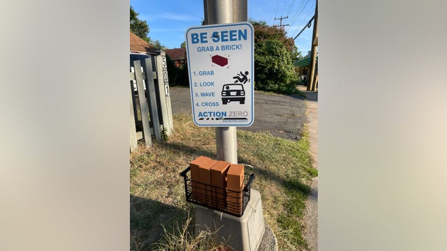 Arlington resident uses fake bricks to call for safer crosswalks