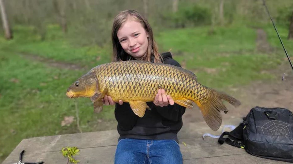 Girl-gets-fishing-award-III.jpg