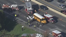 Vehicle pinned under school bus on Capital Beltway, rescue in progress