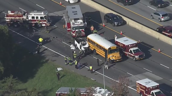 Vehicle pinned under school bus on Capital Beltway, rescue in progress