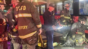 Firefighters rescue woman trapped under Metrobus in DC