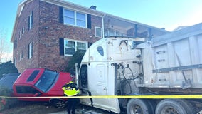 4 hospitalized after tractor trailer crashes into Woodbridge condo