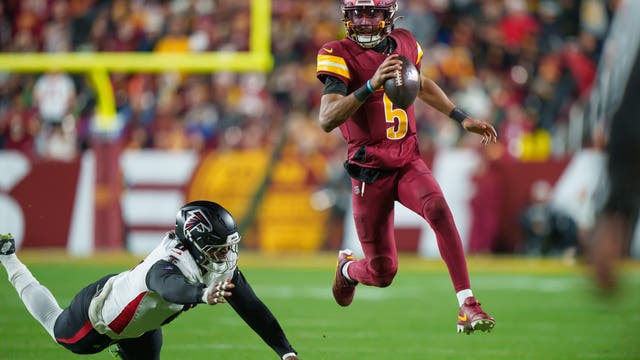 Commanders clinch playoffs in OT win against Falcons