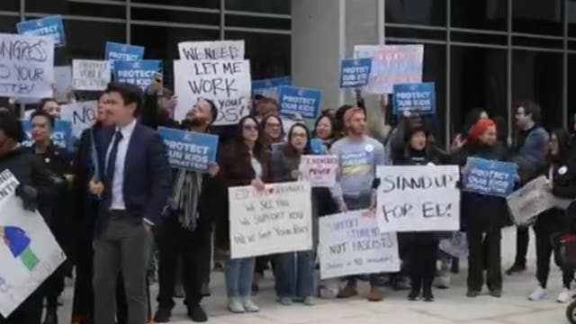 Protestors gather outside of Department of Education following recent layoffs