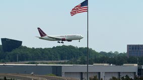 White South African refugees arrive at Dulles