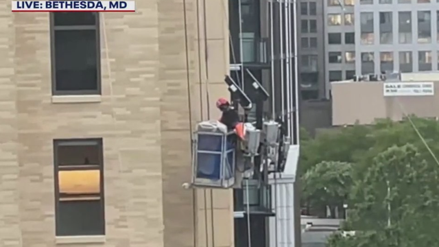 FOX 5 camera catches construction crew coming down high-rise amid severe weather in Bethesda