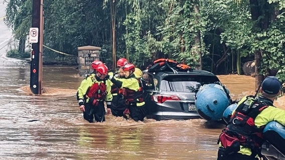 Firefighters rescue 6, including two children, during flash flooding Thursday