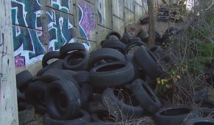 Fairfax County residents frustrated with tires being illegally dumped along commuter line