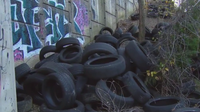 Fairfax County residents frustrated with tires being illegally dumped along commuter line