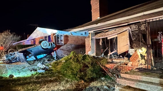 Vehicle overturns, strikes 2 homes in southeast DC