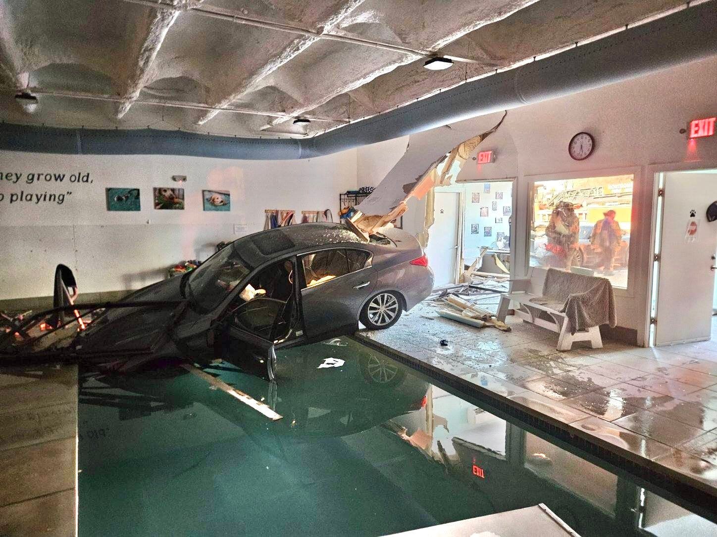Car goes through building, lands in pool in Montgomery County