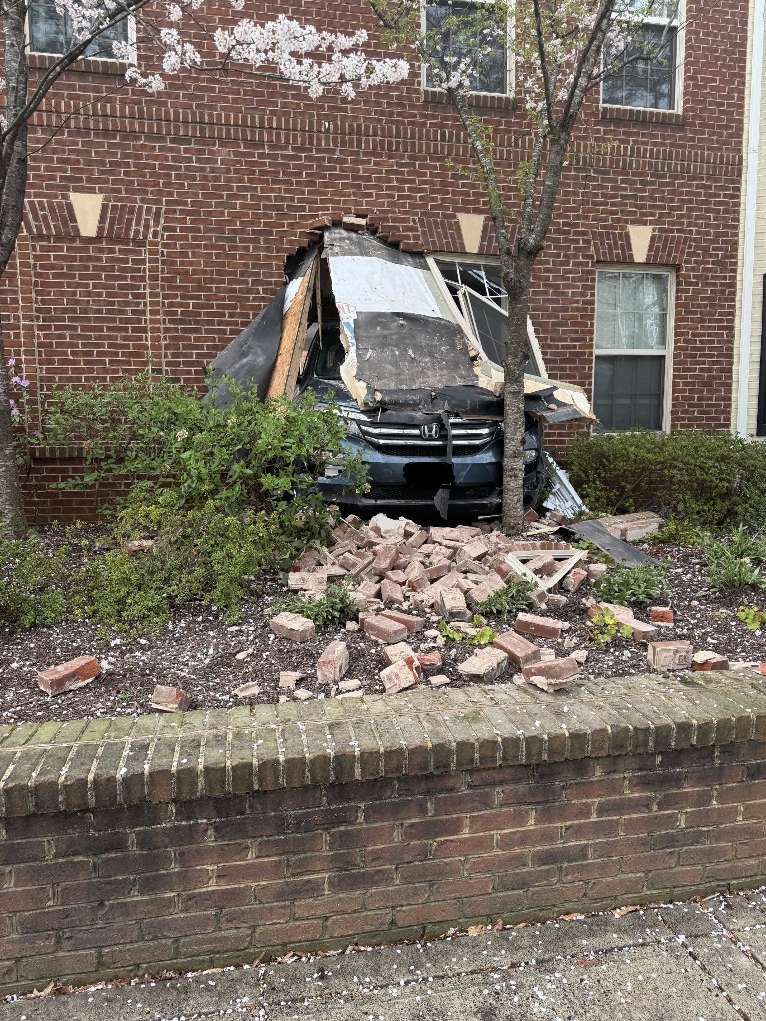 Road closed after car crashed into building in Arlington