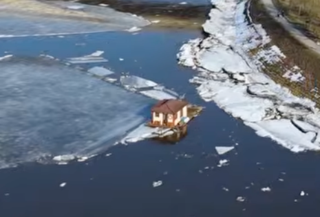 Melting ice sends tiny house drifting down river