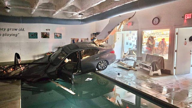 Car goes through building, lands in pool in Montgomery County