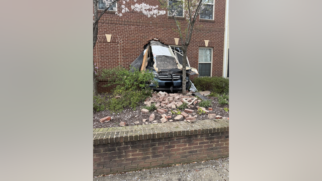 No injuries reported after car plows through building in Arlington