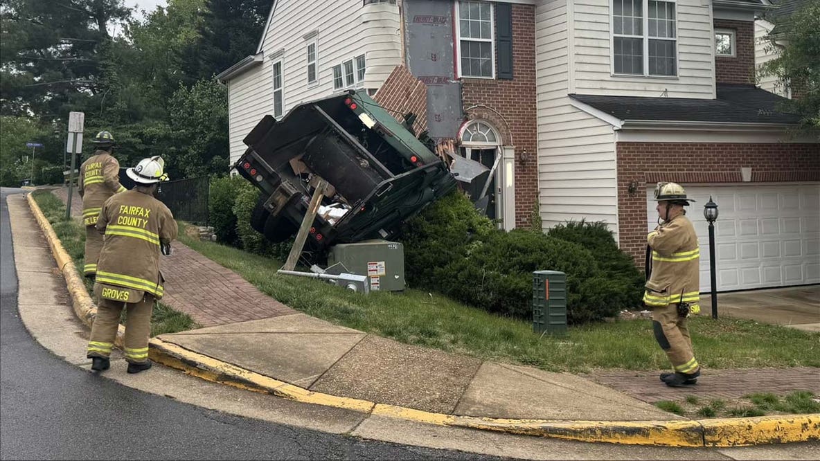 Garbage truck crashes into side of Lorton home