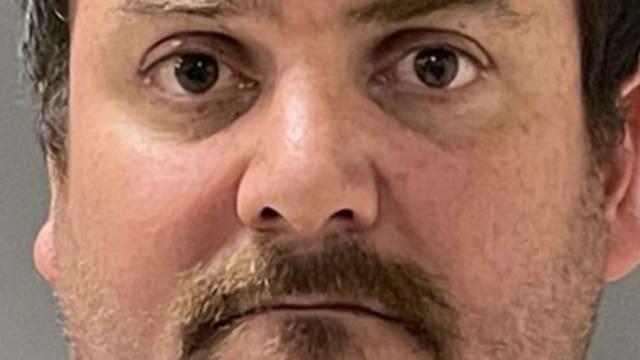 High school employee arrested, charged with recording students in changing room, police say