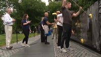 Volunteers wash Vietnam Veterans Memorial wall