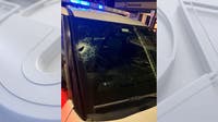 Guitar smashes Leesburg police officer's windshield; police search for suspect