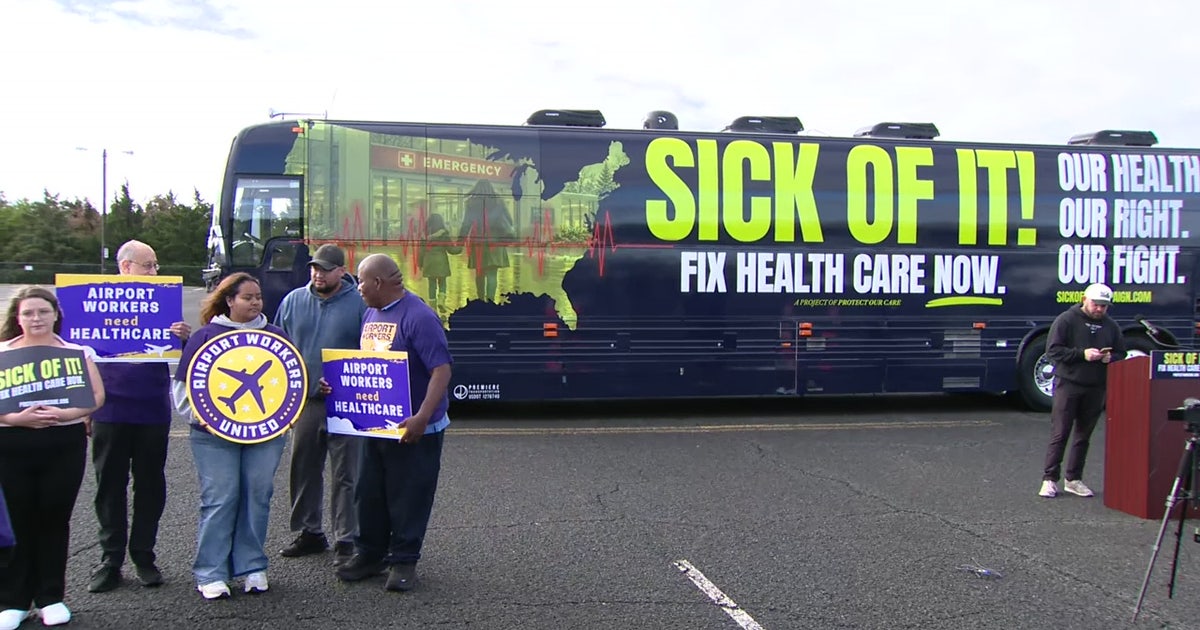 Airport workers rally at Washington Dulles over healthcare costs