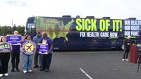 Airport workers rally at Dulles Airport over healthcare