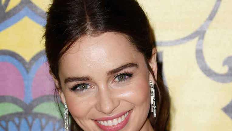 Emilia Clarke smiles at the camera while attending an HBO reception
