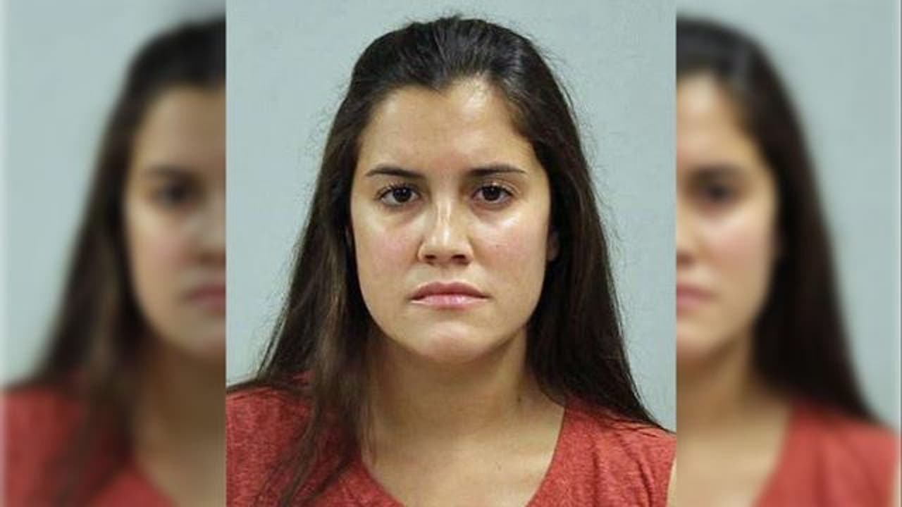 Woman arrested for sunbathing topless in front of child photo