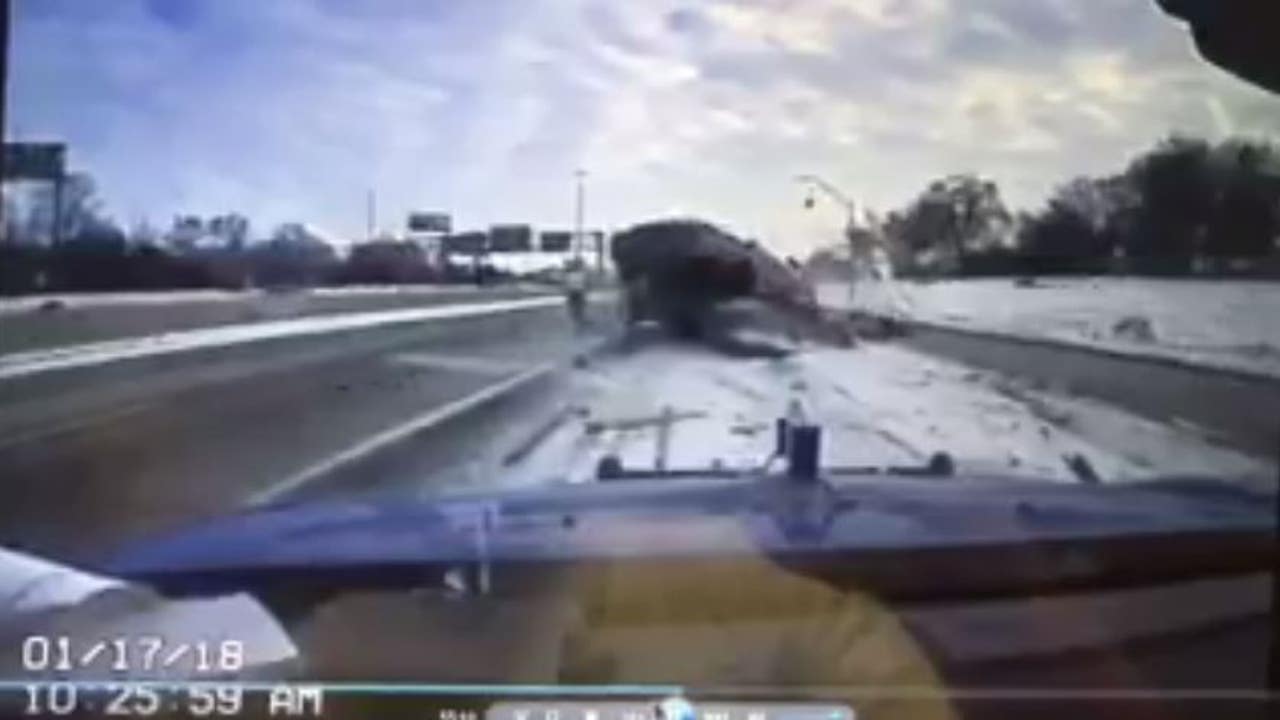 Car hits towed vehicle, goes airborne on Detroit highway