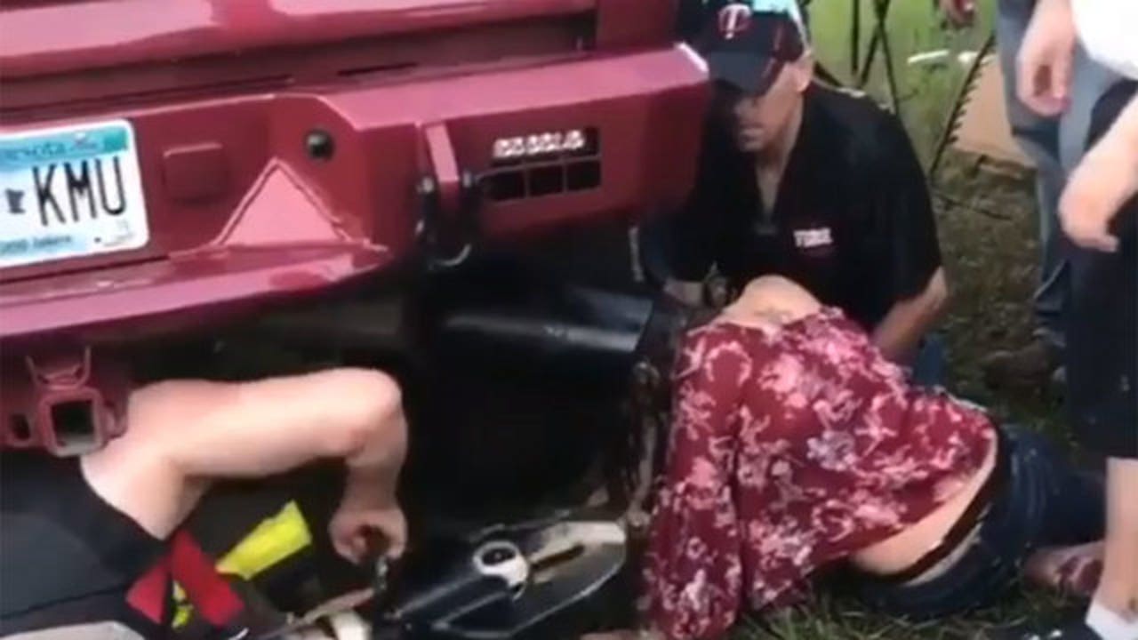Woman gets head stuck in tailpipe