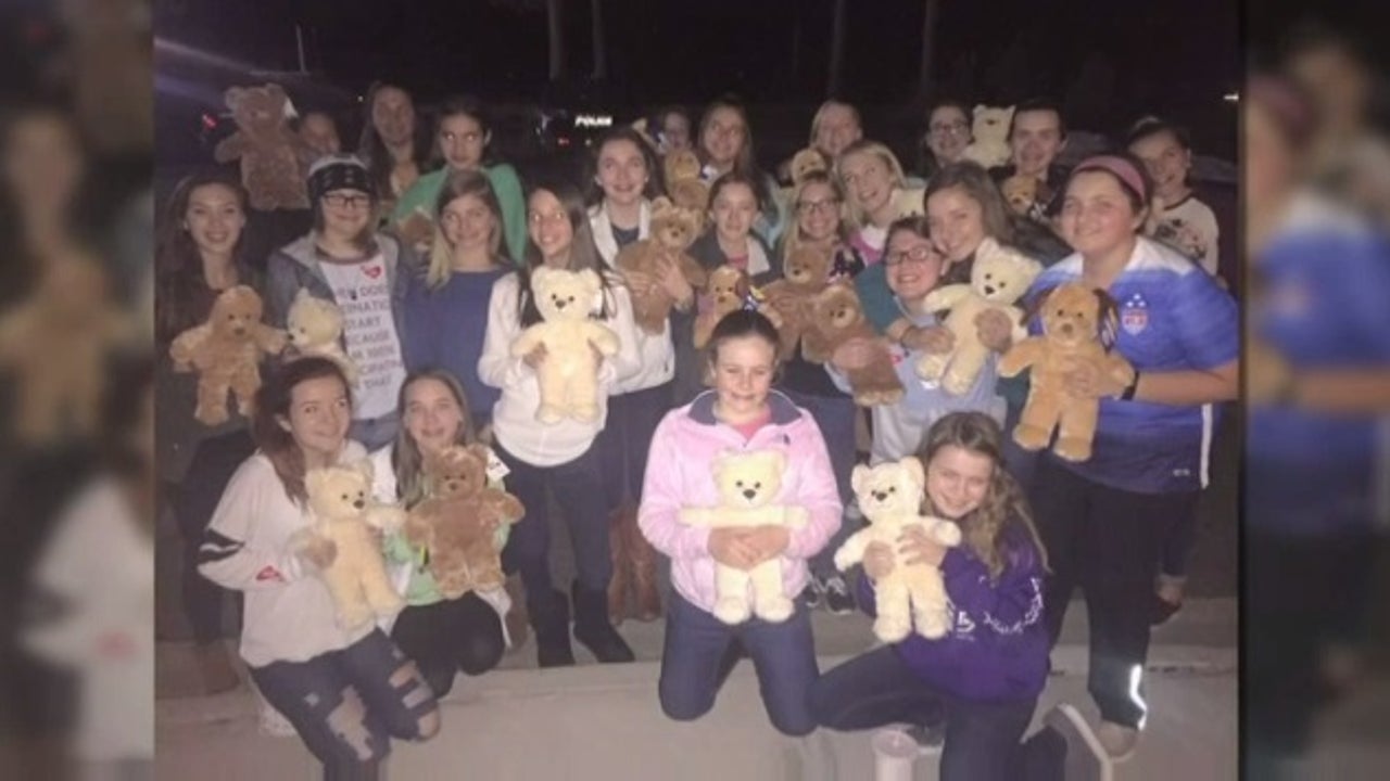 Girls make teddy bears for police officers