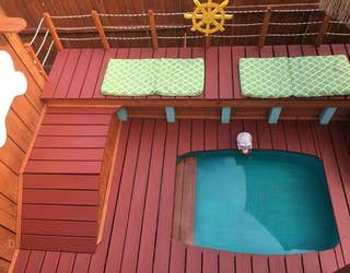 Man builds epic 3 story dog house with electricity running water