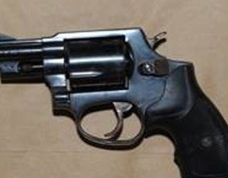 Imam shooting revolver gun
