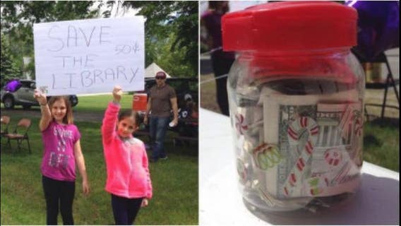 Girl opens lemonade stand to save library