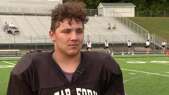 High school football player lifts car off of neighbor, saving his life