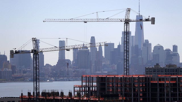 Fed says economic gains tempered by trade worries