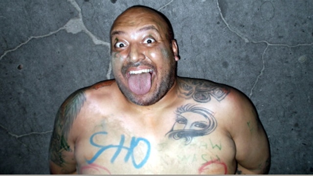 Naked man watering his yard arrested after allegedly confronting deputies with knife