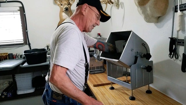 Veteran cuts off arm after hand stuck in meat grinder