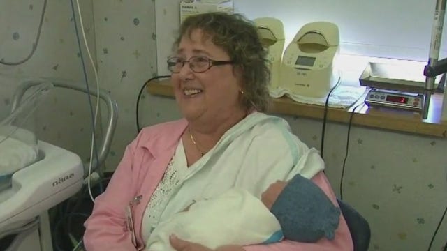 Hospital volunteers cuddle newborns in NICU