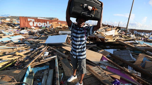 Silence, devastation mark Bahamas town; but some are staying
