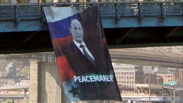 Massive Vladimir Putin banner appears on Manhattan Bridge