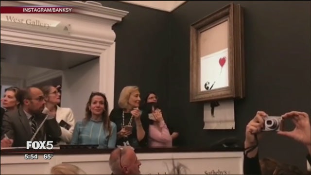 Banksy artwork self-destructs just after $1.4 million sale