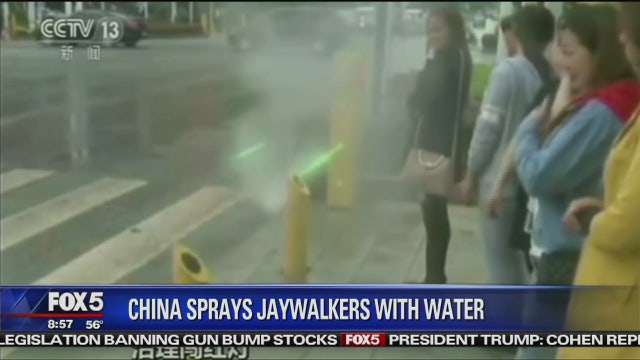 China using water sprays, facial recognition in jaywalking crackdown