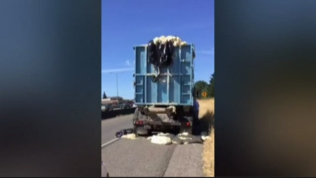 Heat causes dough to rise up out of truck, onto highway