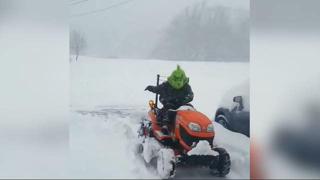 Who knew he had a heart? 'Grinch' spotted plowing snow