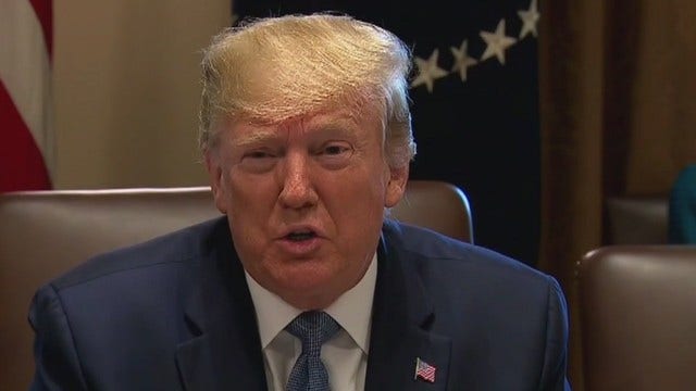 Stepping up feud, Trump assails Cummings as 'racist'