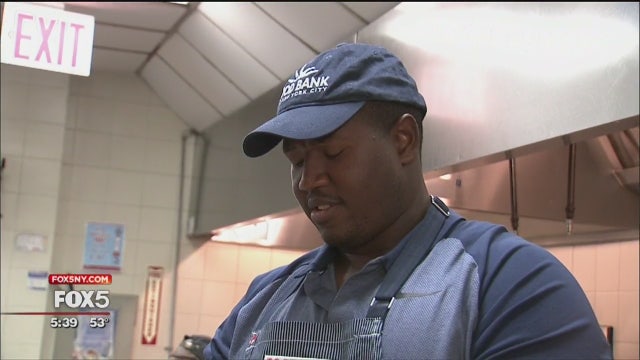 Jets player Kelvin Beachum serves meals in Harlem