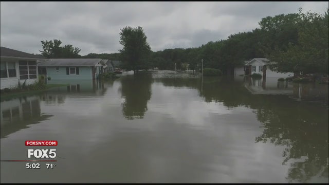 Neighbors help each other with NJ flood cleanup