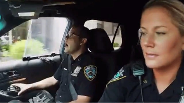 NYPD officers sing in 'cop car pool karaoke' video
